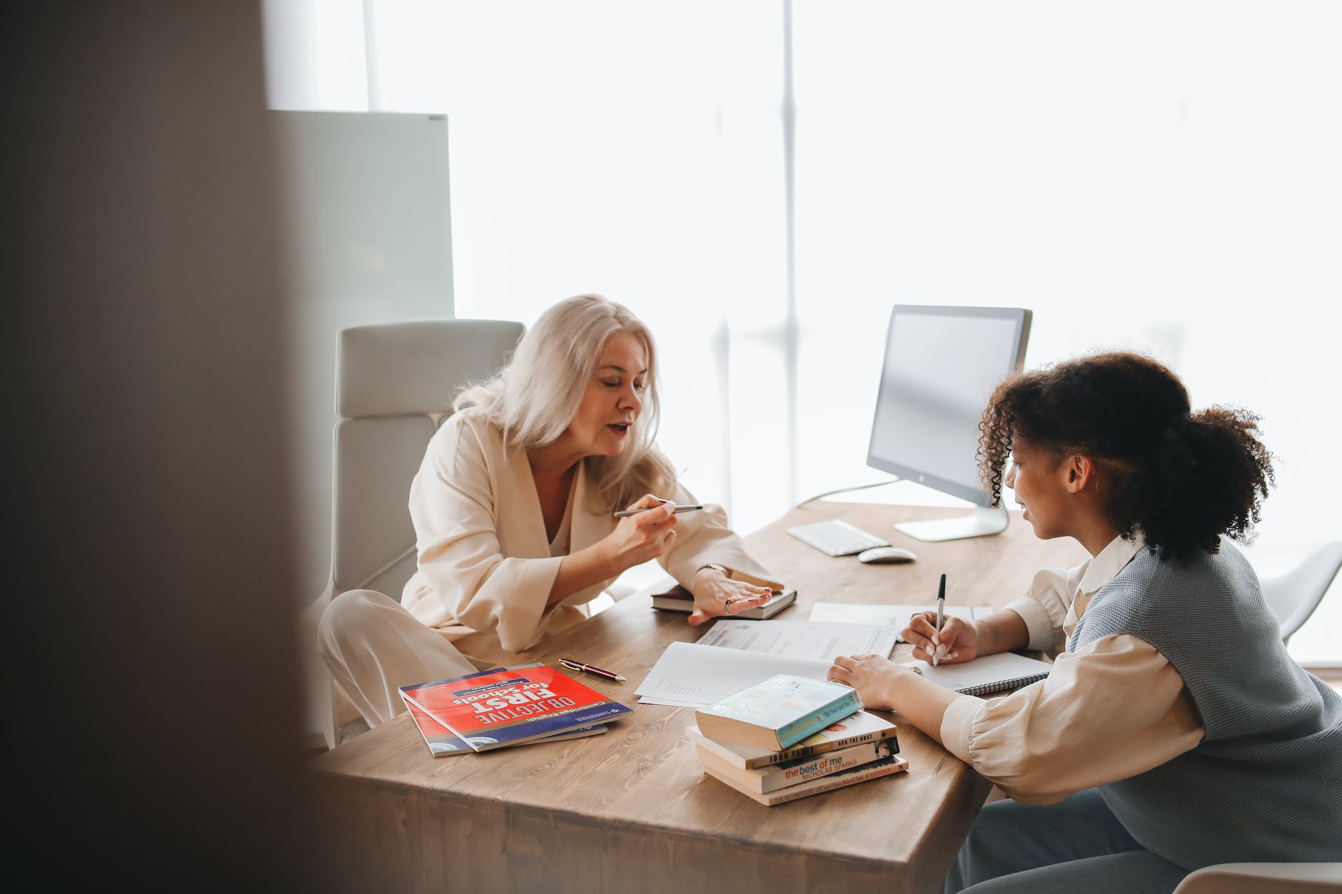 teacher discussing her lesson with her student