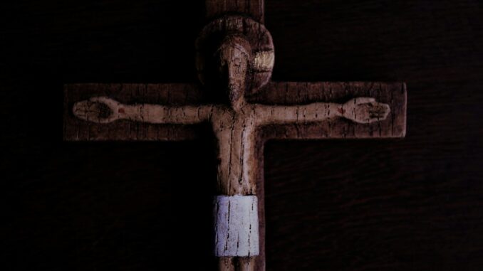 brown wooden cross with white cross