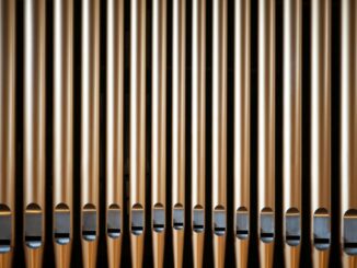 a close up of a metal pipe on a wall