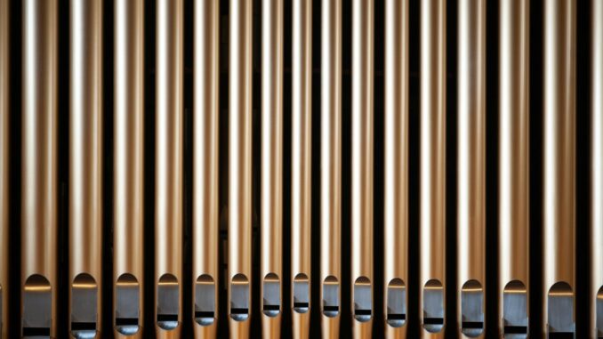 a close up of a metal pipe on a wall